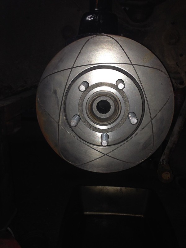 29051133663_31d1d26f98_c Close-up of a silver brake disc with five lug bolts in a vehicle wheel assembly