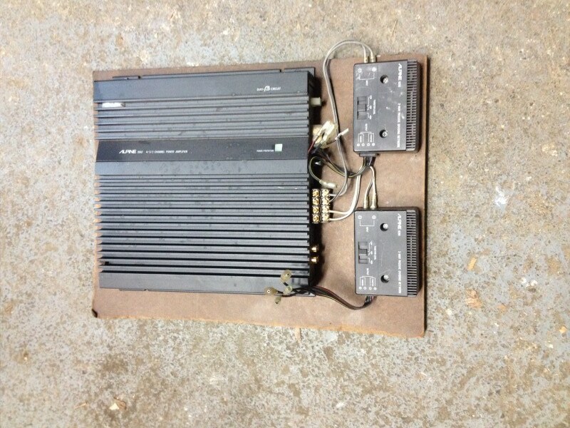 29594502431_77e9c1bbed_c Black Alpine SDA-1175 power amplifier and two Alpine crossover units mounted on a wooden board on a concrete floor
