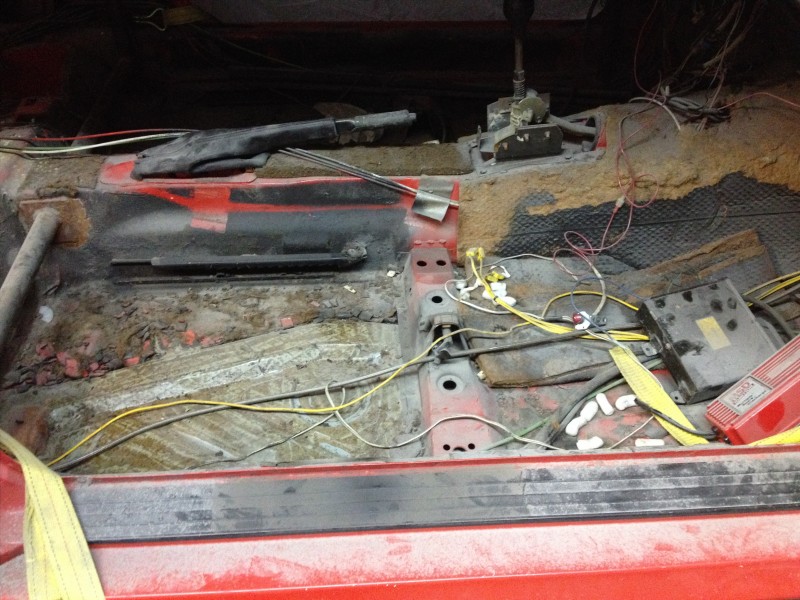 29640244466_a976b95bbe_c Exposed and partially dismantled red vehicle floor with visible wiring and metal components