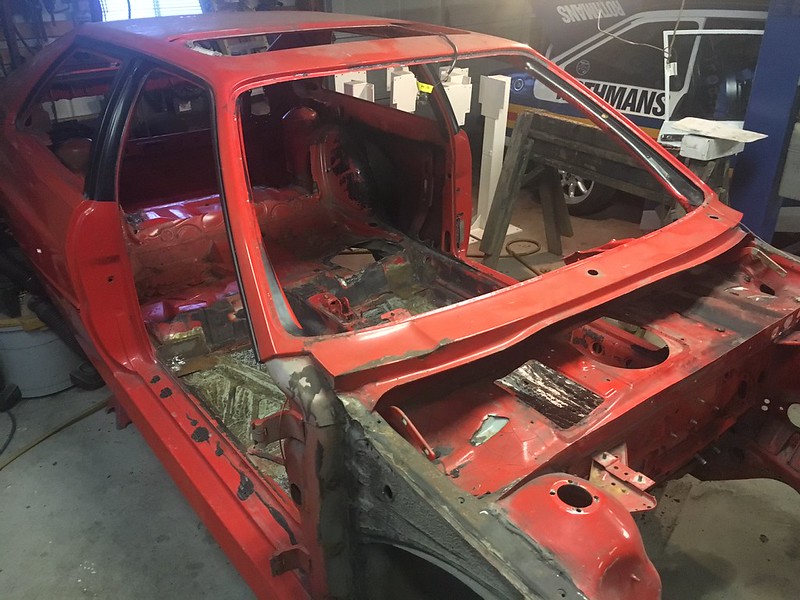 31292561340_615a503c9b_c UR Quattro body stripped down to the frame inside a garage or workshop