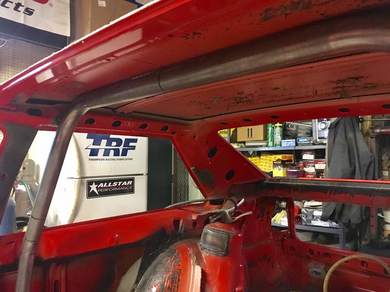 31714908346_19f0856f36_c Interior of a UR Quattro chassis with a metal roll cage bar installed in a workshop with shelves and automotive products