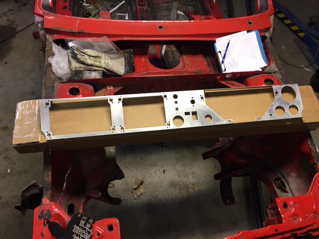31726569086_949cebd767_z Metal frame placed on top of a UR Quattror chassis in a workshop with gloves and a notepad nearby