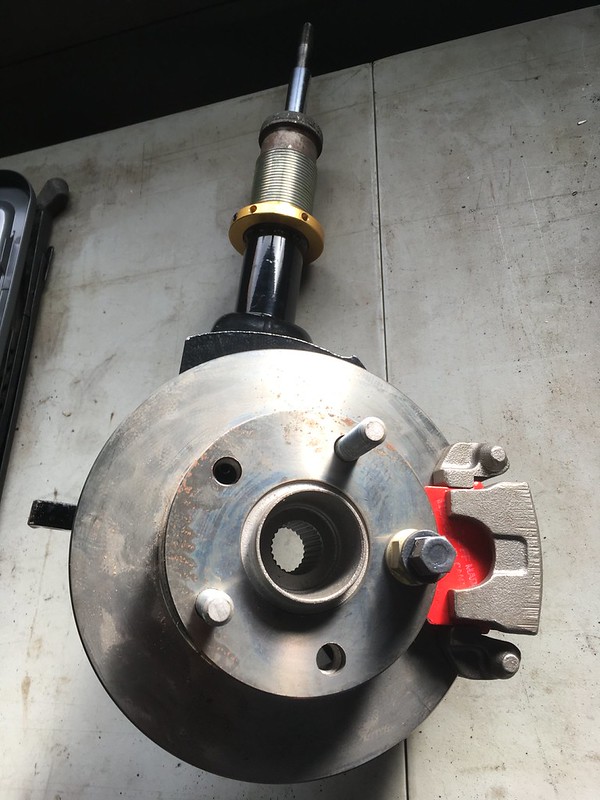 32703806721_aba182e944_c UR Quattro rear suspension and brake assembly including coilover shock absorber, brake rotor, and red brake caliper
