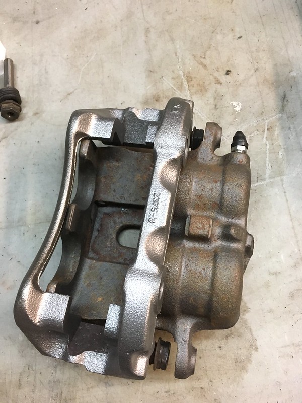 33448542425_160128b928_c Rusty metal brake caliper component on a worn work surface Group B UR Quattro