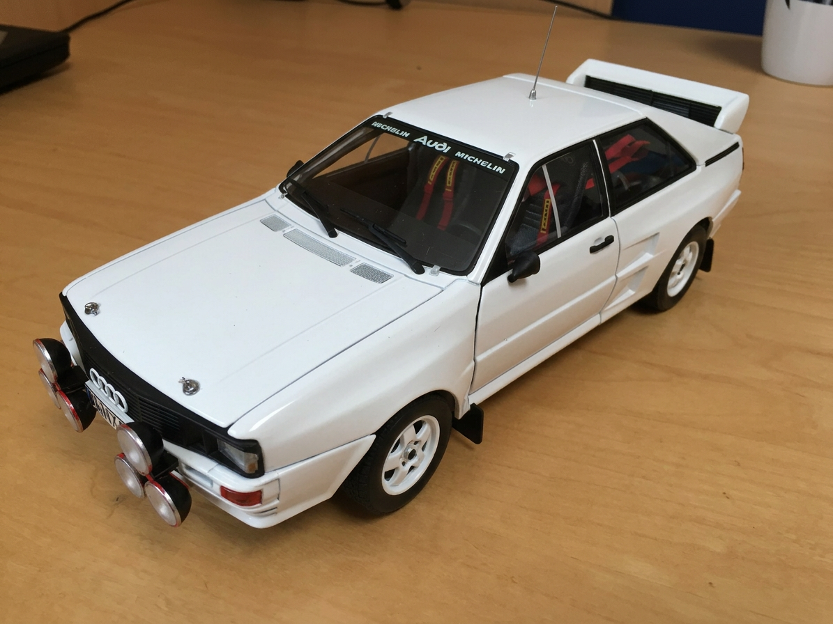 33422960766_8d0a3eb2c5_c White Audi rally car model with four front spotlights on a wooden surface