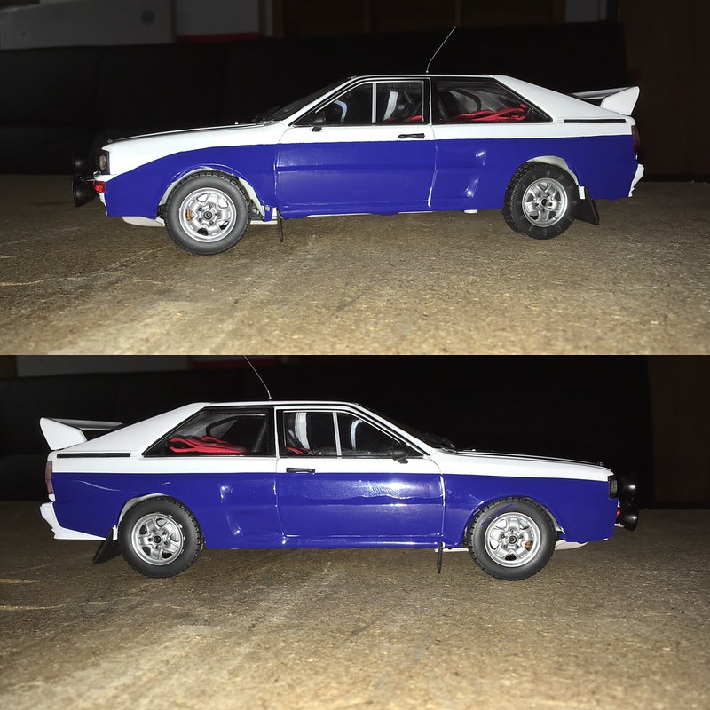 Two side views of a blue and white UR Quattro rally car model with red interior and rear spoiler on a textured surface