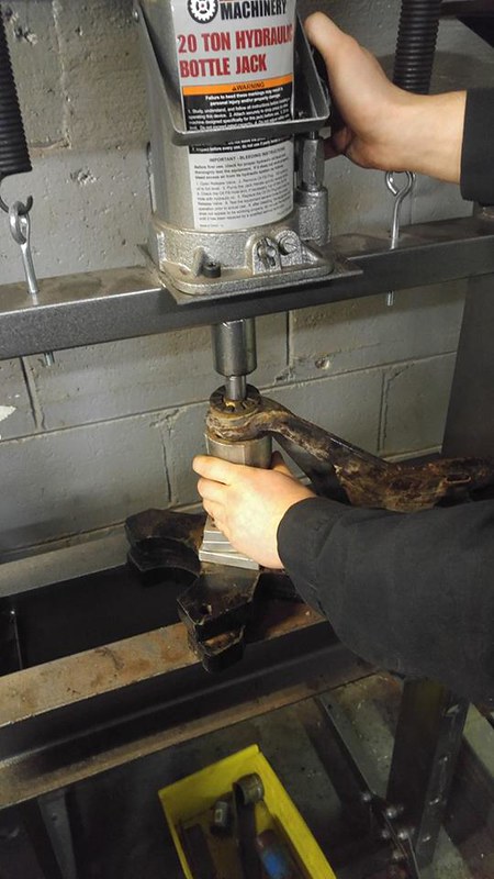 Using a 20 ton hydraulic bottle jack to press or lift a UR Quattro part held by hands