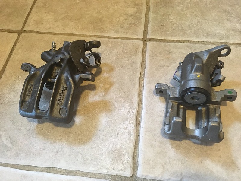 34432125236_1b9621a2b2_c Two metallic UR Quattro brake calipers placed on a tiled floor