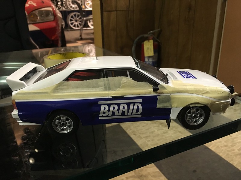 34577068271_97a5d699b5_c White and blue model UR Quattro with BRAID logo, partially covered in masking tape, displayed on a glass surface