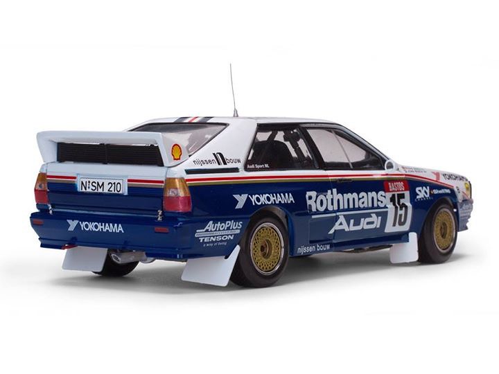 A scale model of a blue Audi UR Quattro featuring Rothmans branding and Yokohama tires, viewed from the rear.